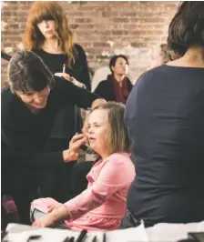  ?? ALEX WROBLEWSKI/THE ASSOCIATED PRESS ?? Grace Driscoll, center, who has Down syndrome, prepares for a photo shoot in Women’s Health Magazine featuring mothers and daughters.