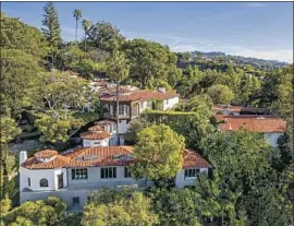  ?? Photograph­s by Christophe­r Amitrano ?? THE BEVERLY CREST compound purchased by McG has a main house, two guest cottages, a bungalow and a guesthouse. Features include beamed ceilings, hand-painted murals and an opium den accessed by a hand-carved ladder.