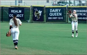  ?? TIM GODBEE / For the Calhoun Times ?? Calhoun’s Carlie Henderson (right) makes a catch in center field as second baseman Anna Taylor looks on during Monday’s game.