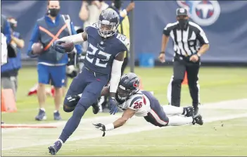 ?? WADE PAYNE/AP ?? Titans running back Derrick Henry avoids a tackle on a 53-yard gain on a screen pass in overtime Sunday.