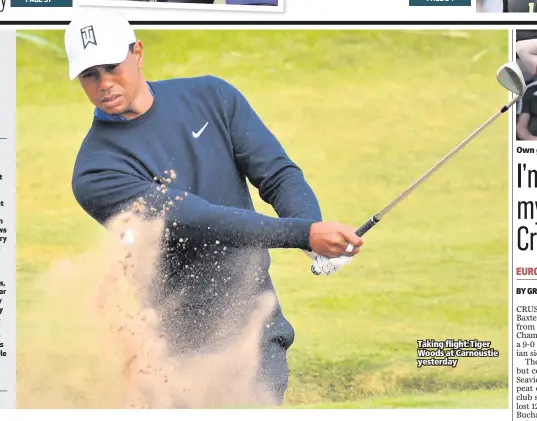  ??  ?? Taking flight: Tiger Woods at Carnoustie yesterday