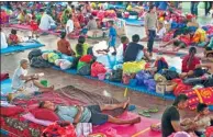  ?? NYOMAN BUDHIANA VIA REUTERS ?? Villagers gather at a temporary evacuation center near Mount Agung volcano in Bali, Indonesia, on Thursday.