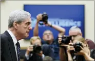  ?? ASSOCIATED PRESS FILE PHOTO ?? Former special counsel Robert Mueller returns to the witness table following a break in his testimony before the House Intelligen­ce Committee on Capitol Hill in Washington.