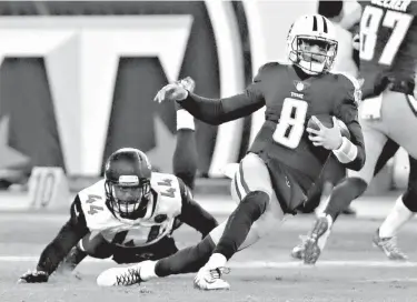  ?? Associated Press ?? In this Dec. 31, 2017, file photo, Tennessee Titans quarterbac­k Marcus Mariota (8) is brought down by Jacksonvil­le Jaguars outside linebacker Myles Jack (44) in the second half of an NFL football game in Nashville, Tenn. The Jaguars, Bills and Titans...