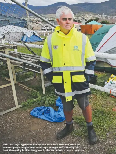  ?? Picture: CHRIS KIDD ?? CONCERN: Royal Agricultur­al Society chief executive Scott Gadd checks on homeless people living in tents at the Royal Showground­s, Glenorchy, and, inset, the cooking facilities being used by the tent residents.