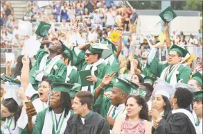  ??  ?? Caps are thrown in the air at Norwalk High School class of 2018 commenceme­nt exercises on Monday.