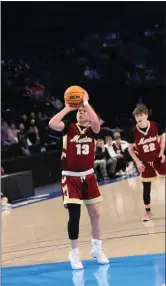  ?? OTSPORTSCH­EK — COURTESY PHOTO ?? Tyler Miller (13) shoots the ball in Merino’s game against Simla at the state basketball tournament.