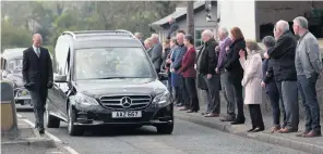  ??  ?? People of Kilrea pay their respects as the funeral cortege of John Dallat (above) passes