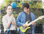  ?? Jacqueline DiMilia IFC Films ?? SONGS help propel the story of a bickering couple (Zoe Lister-Jones and Adam Pally) in “Band Aid.”