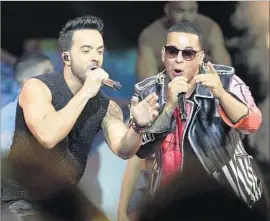  ?? Lynne Sladky Associated Press ?? LUIS FONSI, left, and Daddy Yankee’s remixed “Despacito” adds Justin Bieber.