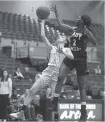  ?? The Sentinel-Record/Mara Kuhn ?? LADY RAMS RUN: Lakeside’s Chloe Porter (14) goes for a layup as Brinkley’s Destiny Cartwright (2) defends in the first round of the Chartwells Spa City Shootout Wednesday night at Bank of the Ozarks Arena. The Lady Rams will face Sylvan Hills in the...