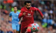  ?? PAUL ELLIS AFP ?? LIVERPOOL’S Mohamed Salah is in great form going into their Premiershi­p contest against Manchester United tomorrow. |