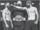  ?? LUCAS NOONAN/BELLATOR ?? Patricio “Pitbull” Freire, left, and Pedro Carvalho weigh in Wednesday for the Bellator 252 featherwei­ght grand prix set for today.