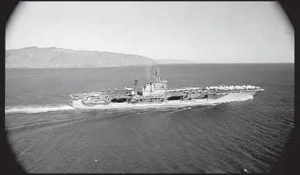  ?? ALEXANDER TURNBULL LIBRARY ?? The USS America on its 1968 visit to Wellington Harbour near Barrett Reef where the wreck of the Wahine was being salvaged.