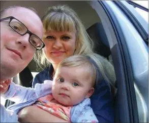  ??  ?? Volha Merry, known as Olya, with husband Derek and daughter Milana