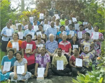  ?? Photo: Fiji Catholic Teachers Associatio­n ?? Teachers with their certificat­es and Bibles after the course. Sitting in the middle are Father Frank Hoare and Father George Ting on December 1, 2017.