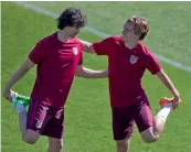  ?? — AP ?? Atletico’s Tiago (left) and Antoine Griezmann warm up in Madrid on Tuesday, the eve of their quarter-final first leg against Leicester.