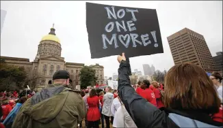  ?? JASON GETZ / AJC ?? The Moms Demand Action Advocacy Day rally at Atlanta’s Liberty Plaza Wednesday drew about 10 times the numbers expected, organizers said, in response to last week’s Florida school shooting.