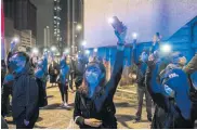  ?? ?? Pro-democracy supporters outside a courthouse in Hong Kong on March 3 this year.