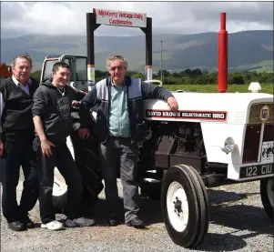  ??  ?? Denis Tangney with his restored David Brown 880 tractor with Stephen and John Bell.