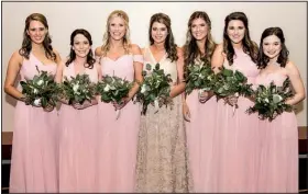  ??  ?? Erin Hedrick of Dallas; Katelyn Ratcliff of Flower Mound, Texas; Mary Katherine Schmidt of Fayettevil­le; Tori McDuffie of Little Rock, sister of the bride; Alexandra Baden of Little Rock, cousin of the bride; Tiffany Maxwell of North Little Rock, sister of the bridegroom; and Hannah Rutherford of Little Rock