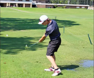  ?? Janice McIntyre/News-Times ?? Nice shot: Jake Mattox, a member of the El Dorado JV team, hits a shot while standing in the water during the 22nd annual Simmons Bank/Wildcat Invitation­al Monday at the El Dorado Golf & Country Club.