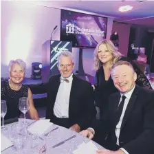  ??  ?? George Brittain, far right, with Joy Yates, second right, North East editorial director, with former Durham and England cricketer Geoff Cook and his wife Judith at a recent awards ceremony.