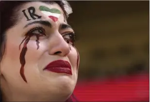  ?? ALESSANDRA TARANTINO THE ASSOCIATED PRESS ?? An Iranian woman breaks into tears after security seized her flag reading “Woman Life Freedom” before the start of the World Cup soccer match between Wales and Iran at the Ahmad Bin Ali Stadium in Al Rayyan, Qatar, on Friday.