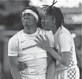  ?? TENNESSEAN GEORGE WALKER IV/THE ?? Ridgeway guard Christophe­r Shields is consoled by teammate Joshua Thornton in the 57-51 against Haywood during a TSSAA Class 3A state boys tournament game on Thursday at Murphy Center in Murfreesbo­ro.