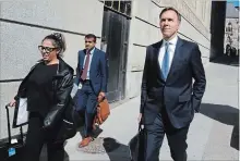  ?? PATRICK DOYLE THE CANADIAN PRESS ?? Finance Minister Bill Morneau leaves a press conference after speaking about the Trans Mountain Expansion project in Ottawa on Wednesday.