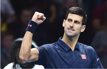  ?? — AFP photo ?? Serbia’s Novak Djokovic celebrates beating Belgium’s David Goffin during their round robin stage men’s singles match on day five of the ATP World Tour Finals tennis tournament in London on November 17, 2016.