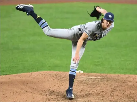  ?? Mitchell Layton/Getty Images ?? Former Pirates pitcher Tyler Glasnow started the season 6-1 with a 1.86 earned run average while averaging 96.6 mph per pitch for Tampa Bay. Then his right forearm tightened.