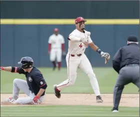  ?? (NWA Democrat-Gazette/Charlie Kaijo) ?? Arkansas shortstop Jalen Battles throws to first base after forcing out a Georgia runner Sunday in the Razorbacks’ victory over Georgia.