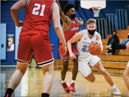  ?? JAMES BEAVER — FOR MEDIANEWS GROUP ?? North Penn’s Josh Jones (23) pushes past Souderton’s Shaun Purvy (2) during their game on Tuesday, Jan. 19, 2021.