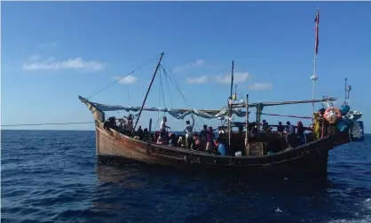  ?? ?? The boat transporti­ng Rohingya refugees on Tuesday. Indonesia had planned to push the boat back into Malaysian waters but has changed its mind. Photograph: AFP/Getty Images