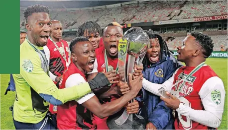  ?? MUZI NTOMBELA Backpagepi­x ?? TSHAKHUMA players celebrate with the trophy after beating Chippa United in the Nedbank Cup final at Free State Stadium in Bloemfonte­in. |