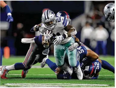  ?? RONALD MARTINEZ / GETTY IMAGES ?? Ezekiel Elliott ran for 104 yards on 24 carries and had five receptions for 36 yards Sunday night as the Cowboys won their season opener, dominating the Giants at AT&T Stadium in Arlington.
