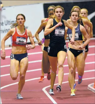  ?? ADOLPHE PIERRE-LOUIS/JOURNAL ?? Mary Cain, center, begins her kick during Sunday’s women’s mile competitio­n at the Albuquerqu­e Convention Center. The 16-year-old Cain pulled away for the victory.