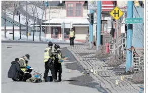  ?? JACQUES BOISSINOT THE CANADIAN PRESS ?? Police investigat­e the scene of a fatal collision, Tuesday in Amqui, Que. Quebec provincial police said they believe the suspect acted deliberate­ly and with premeditat­ion, but they did not suggest a motive.