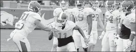  ?? NWA Democrat-Gazette/DAVID GOTTSCHALK ?? (11), shown during drills last week, was beaten on a long pass in man-to-man coverage during Saturday’s scrimmage by freshman receiver Koilan Jackson.