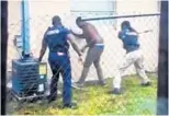  ?? LARA LAIGN/COURTESY ?? A still from a video on Lara Laign's YouTube channel shows the two bail bond agents taking a Lauderdale Lakes man into custody after he failed to show up in court over a driver license suspension.