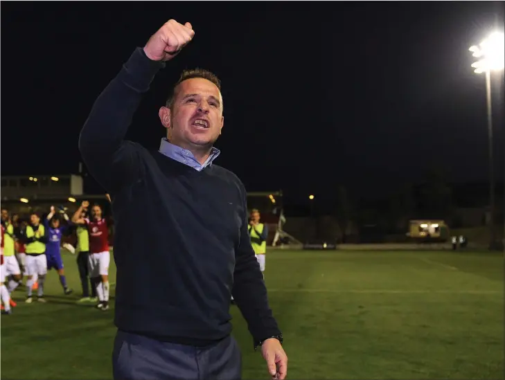  ??  ?? Dave Robertson salutes the fans after the 2- 1 victory over Cork City at Turner’s Cross. Pic: Sportsfile.