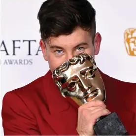  ?? ?? Barry Keoghan poses with the Supporting Actor Award. Photograph: Gareth Cattermole/ BAFTA/Getty Images for BAFTA