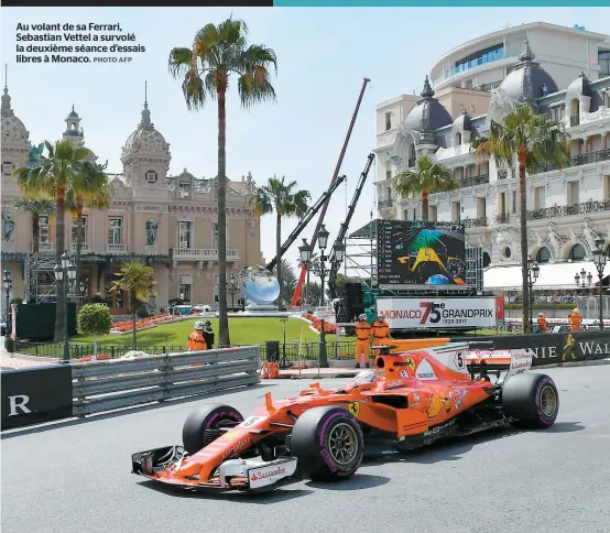  ??  ?? Au volant de sa Ferrari, Sebastian Vettel a survolé la deuxième séance d’essais libres à Monaco.