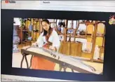  ?? JEFF MCDONALD U-T ?? As part of the Chinese New Year celebratio­n a woman performs “The Fisherman's Song at Dusk” on the Guzheng, via Youtube.