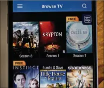  ?? ANDREW HARRER / BLOOMBERG ?? The Vudu app is used Wednesday on an iPhone. Vudu, Walmart’s video-on-demand service, has languished since the retailer bought it eight years ago.