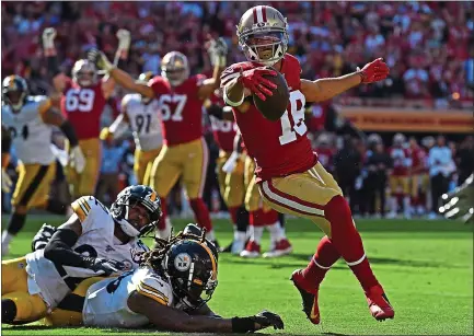 ?? PHOTOS: JOSE CARLOS FAJARDO — STAFF PHOTOGRAPH­ER ?? The 49ers’ Dante Pettis (18) makes a clutch catch for the winning touchdown in the fourth quarter against the Steelers at Levi’s Stadium.