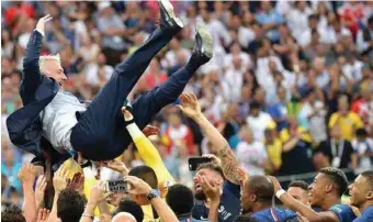  ??  ?? World Cup winning coach, Didier Deschamps in majestic celebratio­n with his players after the match