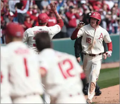  ?? (NWA Democrat-Gazette/J.T. Wampler) ?? Arkansas’ Heston Kjerstad heads toward home plate after hitting a game-winning home run to give Arkansas a 5-3 victory over South Alabama on Sunday at Baum-Walker Stadium in Fayettevil­le. It was Kjerstad’s third career game-winning hit.