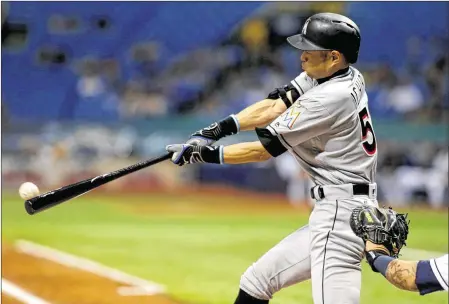  ?? GETTY IMAGES ?? Miami’s Ichiro Suzuki singles to load the bases in the sixth inning Wednesday vs. the Rays in St. Petersburg. The Marlins hung on to win 10-6.